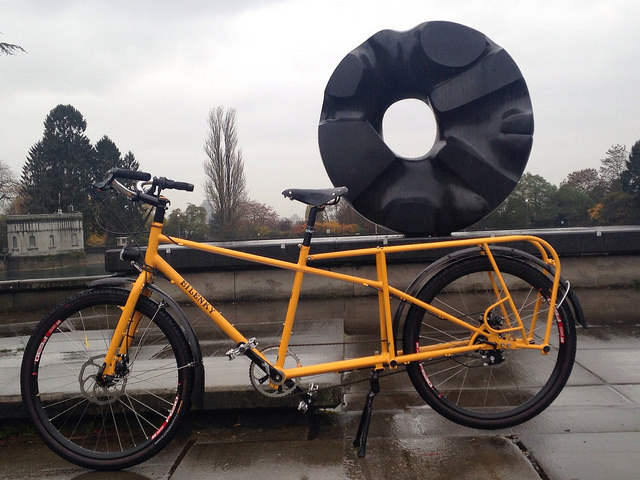 A cargo bike positioned to look like it is carrying a sculpture